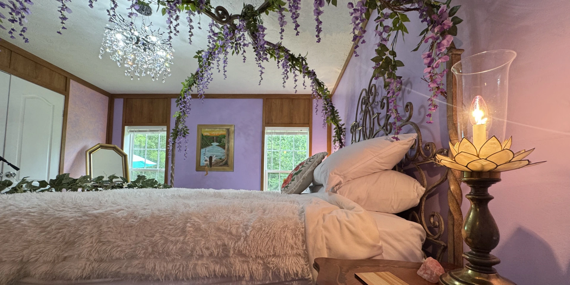 Bed in beautiful purple bedroom